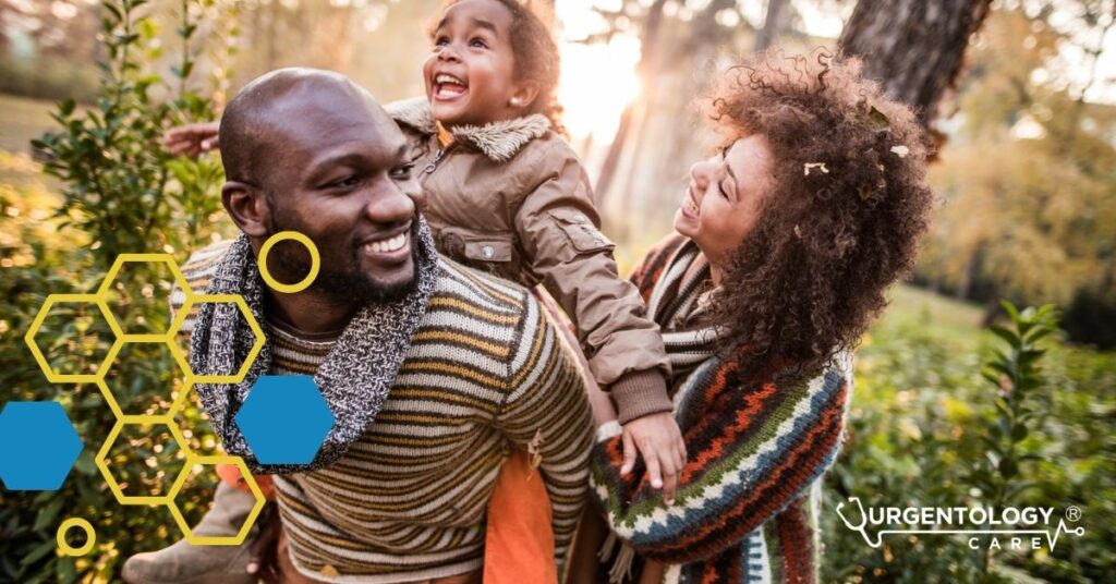family laughing outside fall