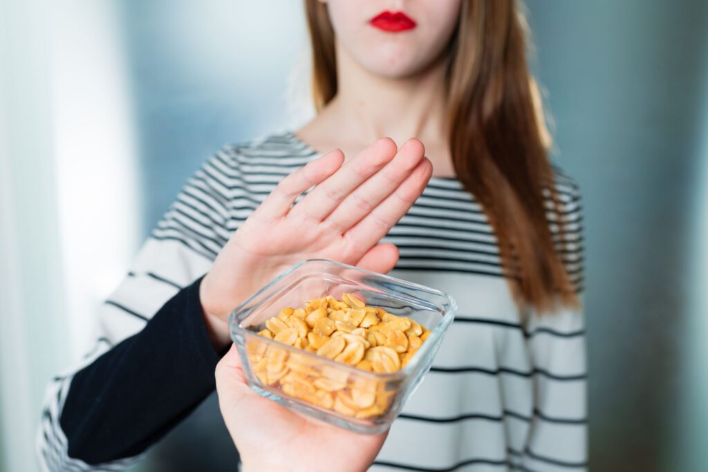 woman saying no to food due to allergies