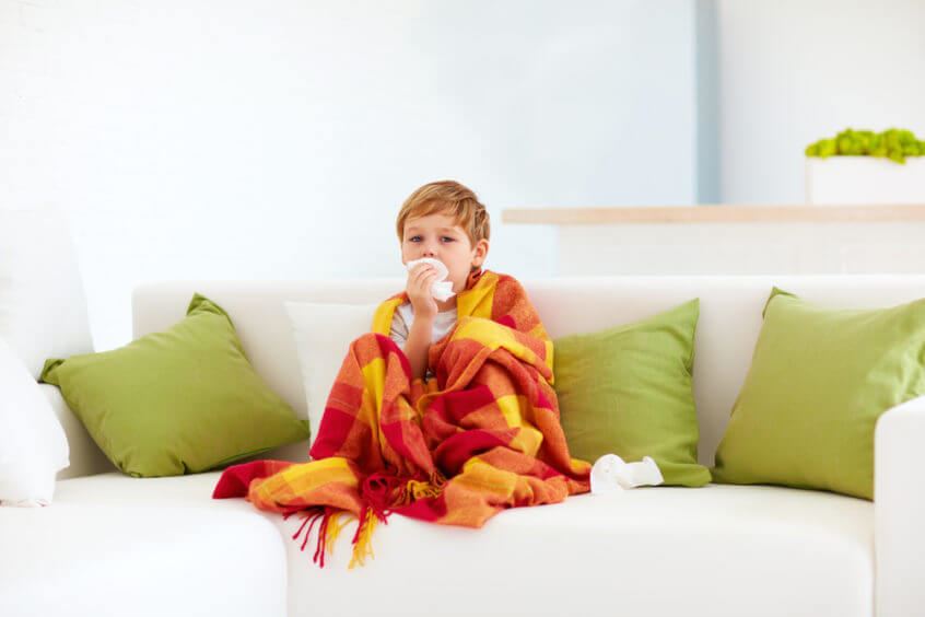 child on the couch with a cold